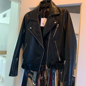 Black “leather jacket” with silver buckling